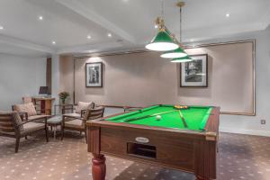 a billiard room with a pool table in it at Royal Regency Paris Vincennes in Vincennes