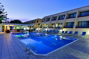 a large swimming pool in front of a building at Napa Prince Hotel Apts in Ayia Napa