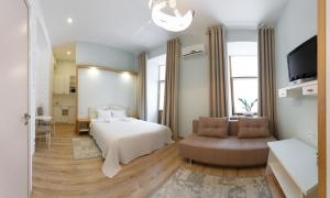 Postel nebo postele na pokoji v ubytování Basseynaya Apart Hotel
