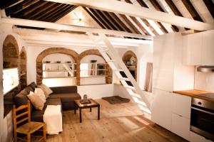a living room with a staircase in a building at 1 - EL PALOMAR de TARIFA - ENJOY TARIFA in Tarifa