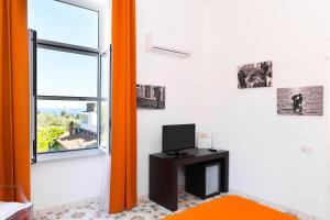 TV a/nebo společenská místnost v ubytování Artis Domus Relais & Spa