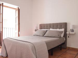Posteľ alebo postele v izbe v ubytovaní Ambrosio Flats Valencia - El Carmen