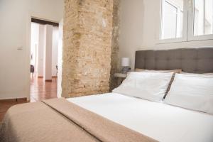 Posteľ alebo postele v izbe v ubytovaní Ambrosio Flats Valencia - El Carmen