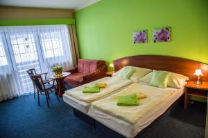 Voodi või voodid majutusasutuse Hotel Centrum Harrachov toas