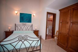 a bedroom with a bed and a dresser at Apartment La roza in Funtana