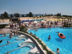 a group of people in a swimming pool at a beach at Nessebar Beach Hotel in Sunny Beach