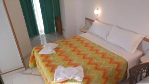Postel nebo postele na pokoji v ubytování Hotel Memory