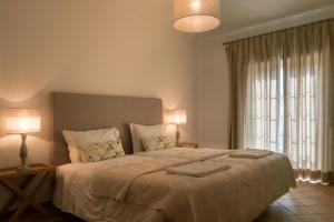 Uma cama ou camas num quarto em T3 Vila dos Principes