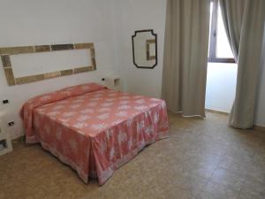 Postel nebo postele na pokoji v ubytování Masseria Prisuti