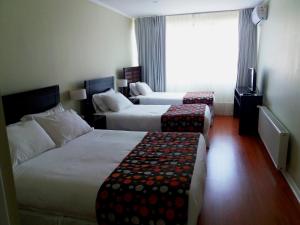 Postel nebo postele na pokoji v ubytování Hotel Del Rio