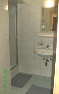 a bathroom with a shower and a sink at Apart Dorfblick in Kaunertal