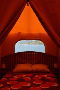 Postel nebo postele na pokoji v ubytování Camping le Mas de Riri