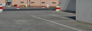an empty parking lot next to a building at Casa Alonso in Narón