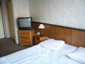 Łóżko lub łóżka w pokoju w obiekcie Karet Obiekt Hotelowy