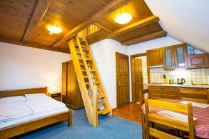 Postel nebo postele na pokoji v ubytování Apartmány Udatný