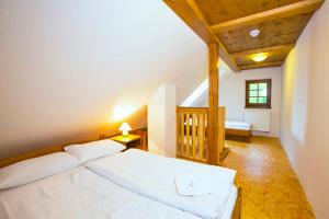 Postel nebo postele na pokoji v ubytování Apartmány Udatný