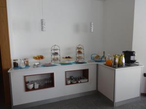 Kuchyň nebo kuchyňský kout v ubytování Hotel Bonjardim