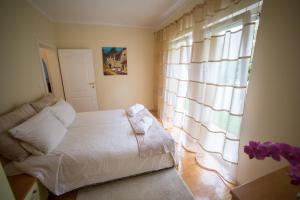 Postel nebo postele na pokoji v ubytování Apartments Villa Majda