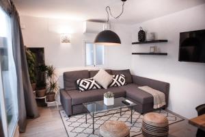 a living room with a couch and a table at 5 - LA TERRAZA de TARIFA - ENJOY TARIFA in Tarifa