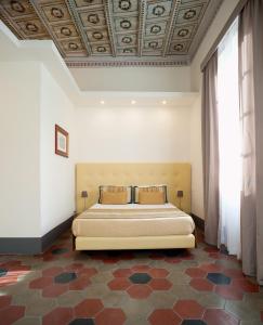 Postel nebo postele na pokoji v ubytování Antico Angelo - Residenza d'Epoca