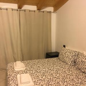 a bedroom with a bed with a shower curtain at Casa Santella in Ceto