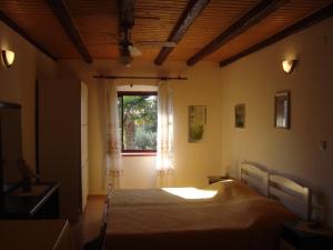 Postel nebo postele na pokoji v ubytování Apartments Lovor