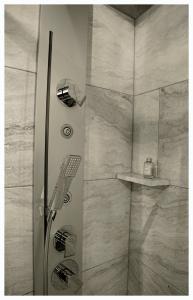 a shower with a glass door in a bathroom at B&B San Nicol&ograve; in Montegiorgio