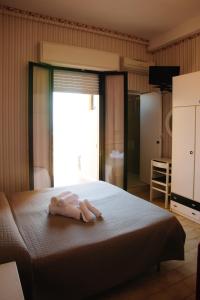 Postel nebo postele na pokoji v ubytování Hotel Eden