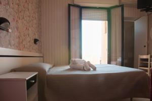 Postel nebo postele na pokoji v ubytování Hotel Eden