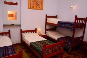 Poschodová posteľ alebo postele v izbe v ubytovaní Hostal Yatasto