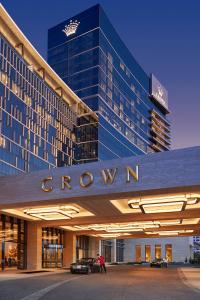 a large building with a sign that says crovation at Crown Towers Perth in Perth