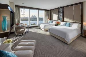 a hotel room with two beds and a large window at Crown Towers Perth in Perth +24 photos