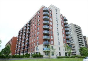 a large apartment building with balconies on the side of it at Deguire Palace in Montreal