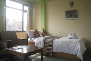 Ένα ή περισσότερα κρεβάτια σε δωμάτιο στο Hotel Yala Peak