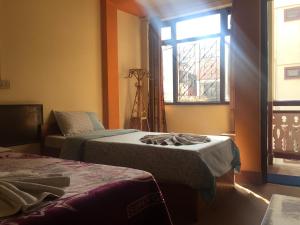 Ένα ή περισσότερα κρεβάτια σε δωμάτιο στο Hotel Yala Peak