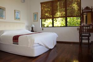 
A bed or beds in a room at Nanga Damai Homestay

