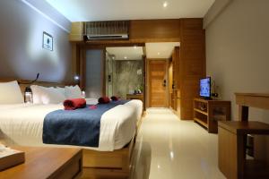 Ein Bett oder Betten in einem Zimmer der Unterkunft Koh Ma Beach Resort - SHA Extra Plus