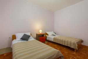 Postel nebo postele na pokoji v ubytování Bulat Sea View Apartments