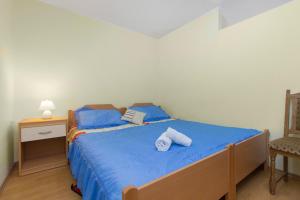 Postel nebo postele na pokoji v ubytování Bulat Sea View Apartments