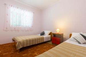 Postel nebo postele na pokoji v ubytování Bulat Sea View Apartments