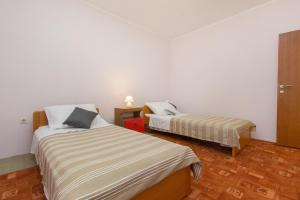 Postel nebo postele na pokoji v ubytování Bulat Sea View Apartments