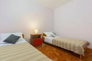 Postel nebo postele na pokoji v ubytování Bulat Sea View Apartments