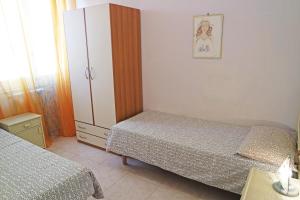 Łóżko lub łóżka w pokoju w obiekcie Eleatica Holiday Apartment