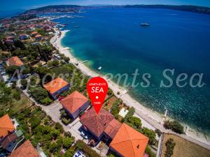 an overhead view of a beach with a sea sign at Apartments Sea in Trogir