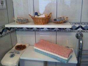 a shelf with a towel and a basket on it at Apartment Josip in Korčula +46 photos