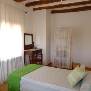 Cama o camas de una habitación en Casa Les Germanes