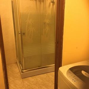 a shower in a bathroom next to a microwave at Galappathie Residence in Tangalle +53 photos