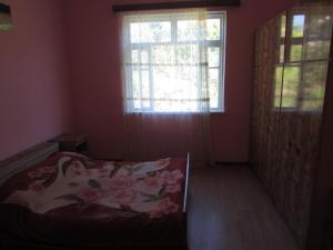 Postel nebo postele na pokoji v ubytování Joni Guest House