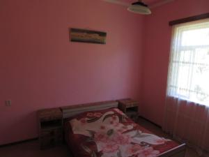 Postel nebo postele na pokoji v ubytování Joni Guest House