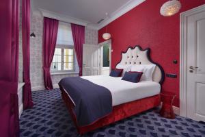 Łóżko lub łóżka w pokoju w obiekcie Relais & Châteaux Hotel Quadrille - Adults Only